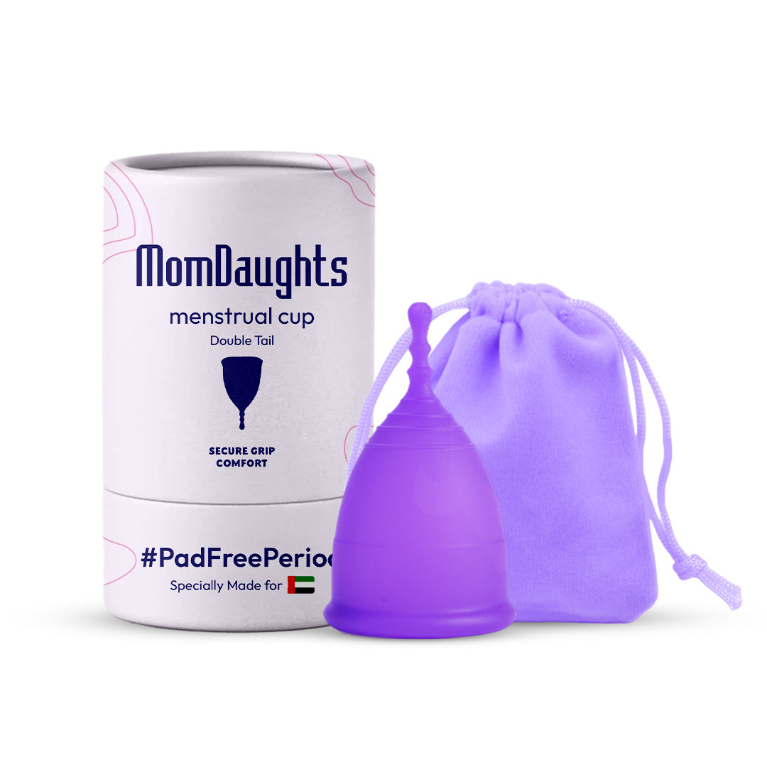 Front view of MomDaughts' Double Tail Menstrual Cup in purple color with cotton bag