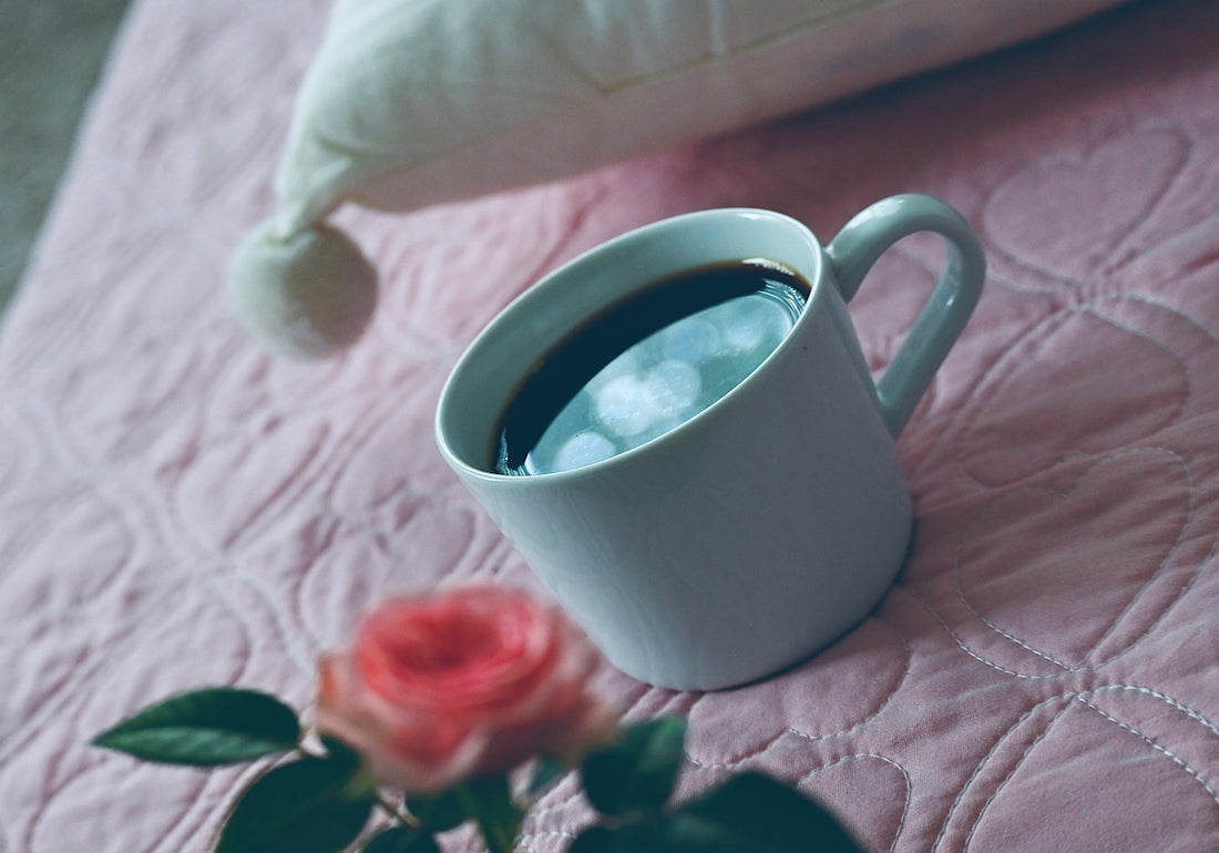 white ceramic mug with black liquid