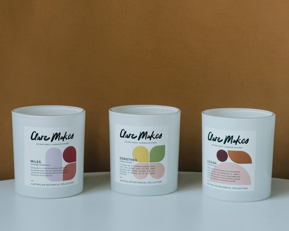three white cups sitting on top of a table