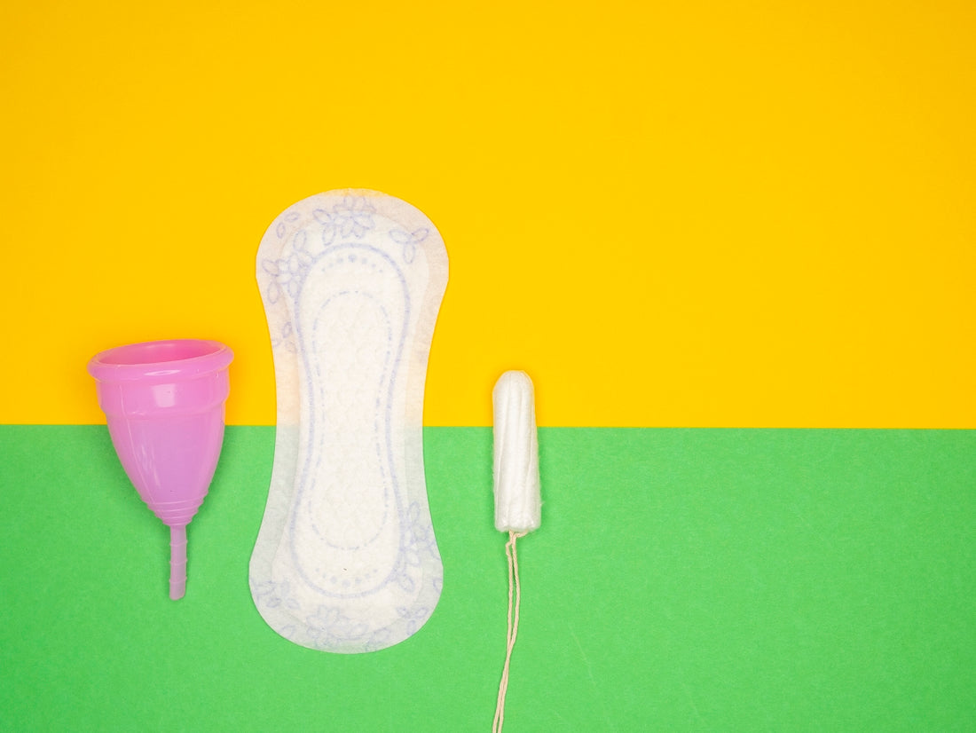 a hairdryer and a pair of shoes on a green and yellow background