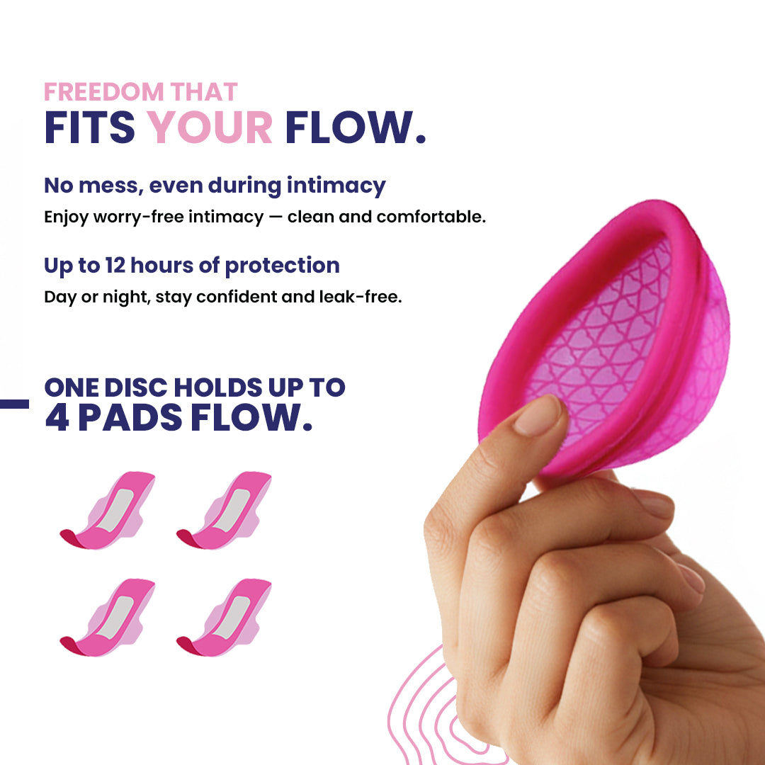 Pink menstrual disc held by a hand with product features highlighted on a white background